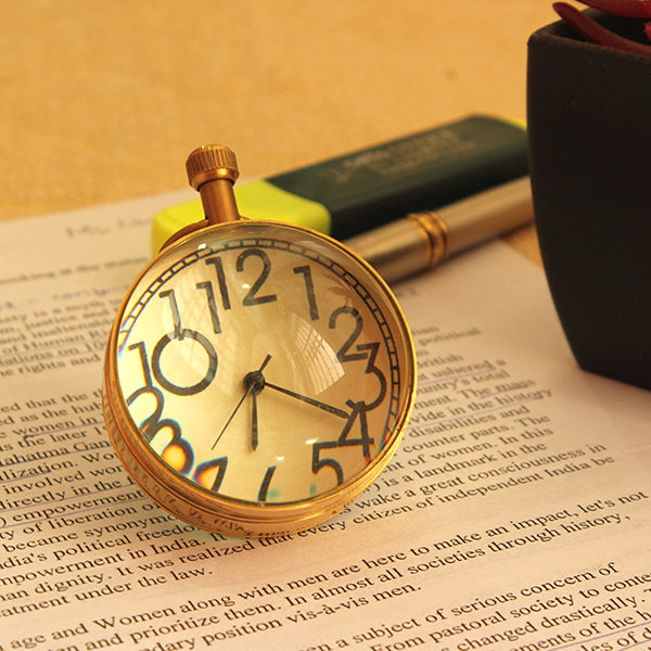 vintage-golden-timepiece-paper-weight