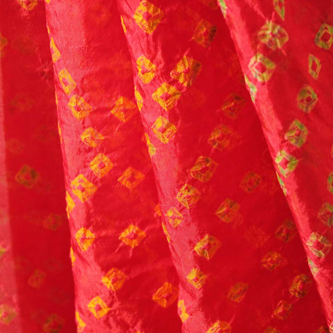 Red Bandhej with yellow block colored traditional wear saree with zari border