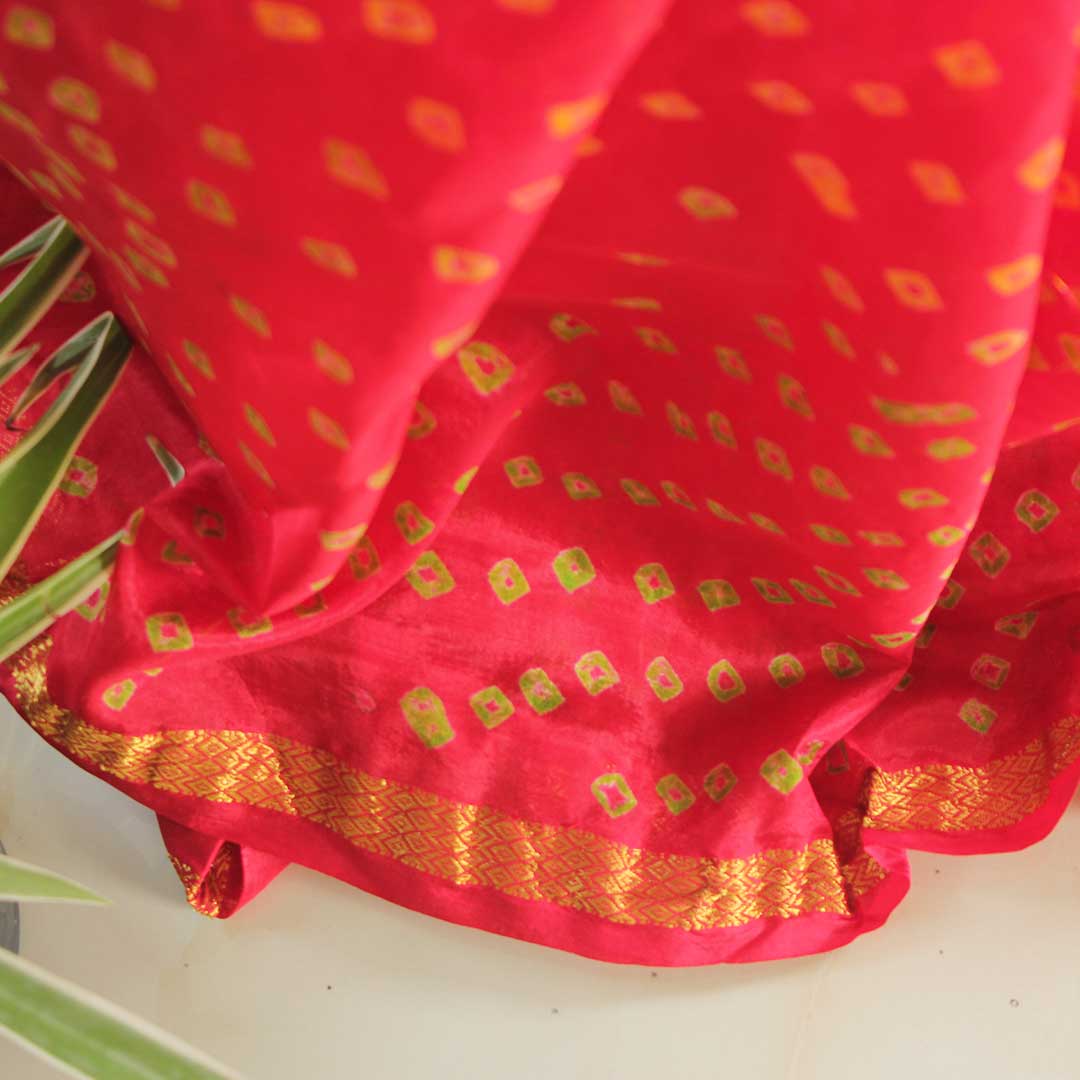 Red Bandhej with yellow block colored traditional wear saree with zari border